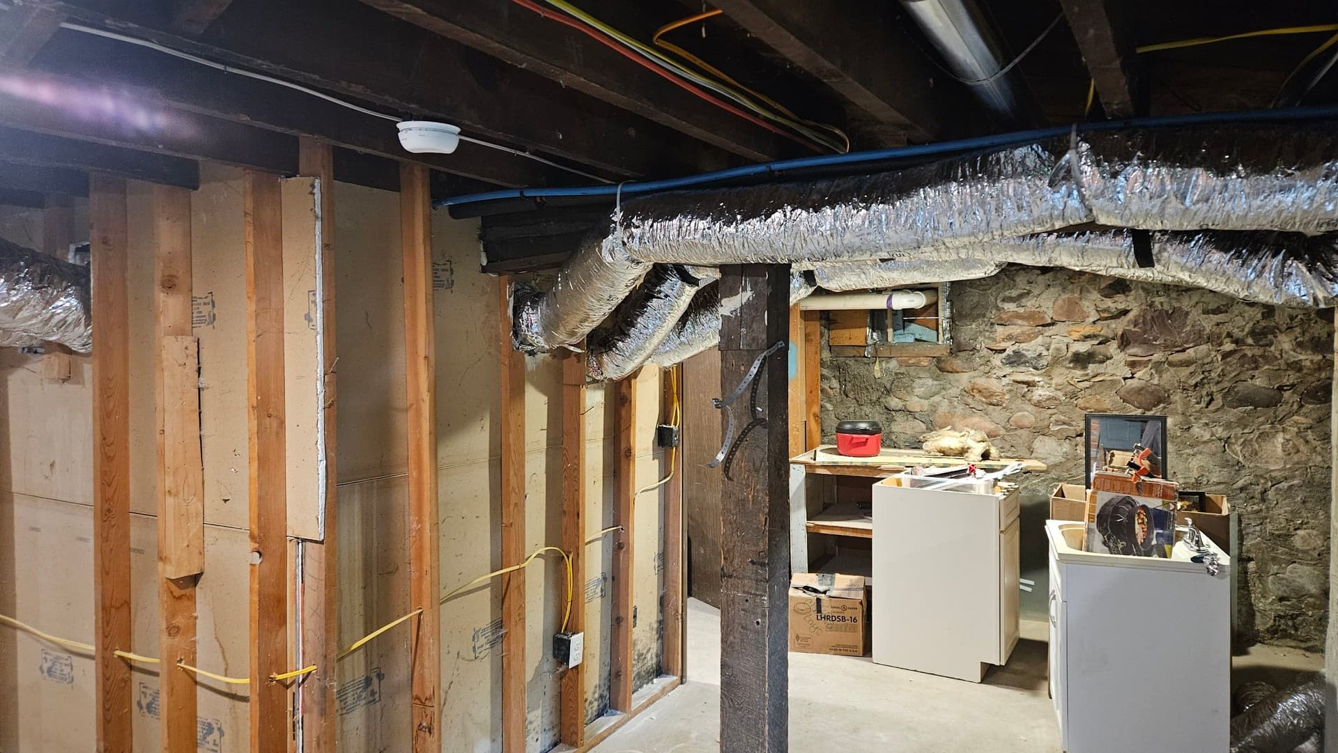 Gallery photos for Asbestos Duct Removal and New Flex Duct Installation in a Basement: Image #1