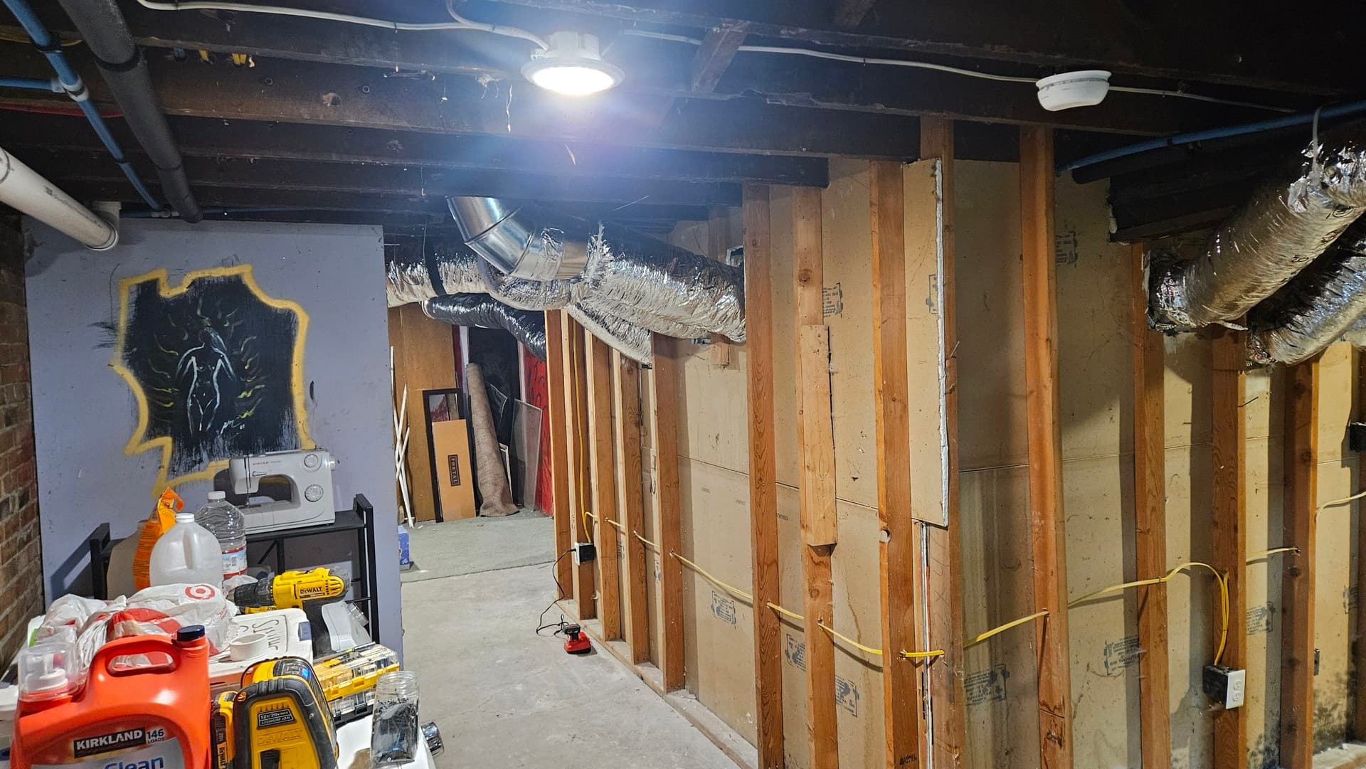 Asbestos Duct Removal and New Flex Duct Installation in a Basement image